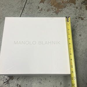 MANOLO BLAHNIK empty shoe box with a cotton bag.